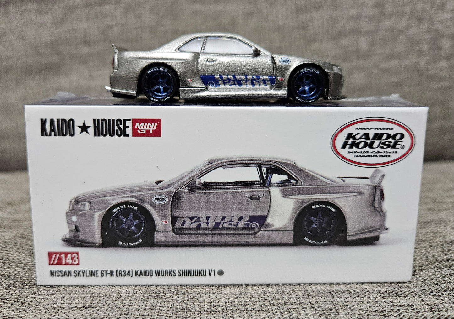 Kaido House x Mini GT 1:64 Nissan GT-R (R34) Kaido Works SHINJUKU V1 Silver #143